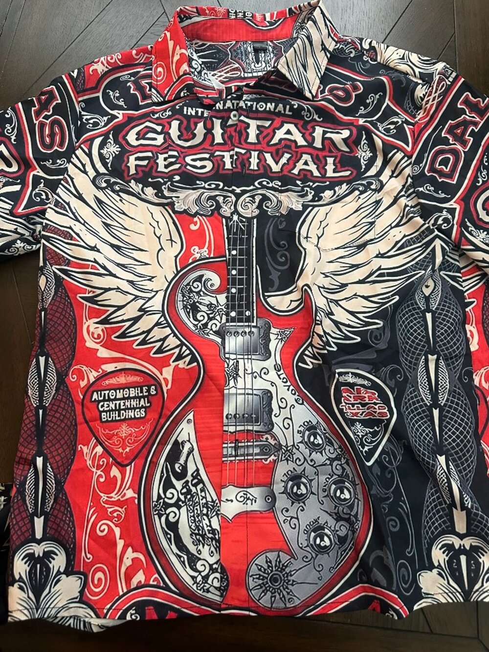 Fun guitar shirt.  Lightweight polyester